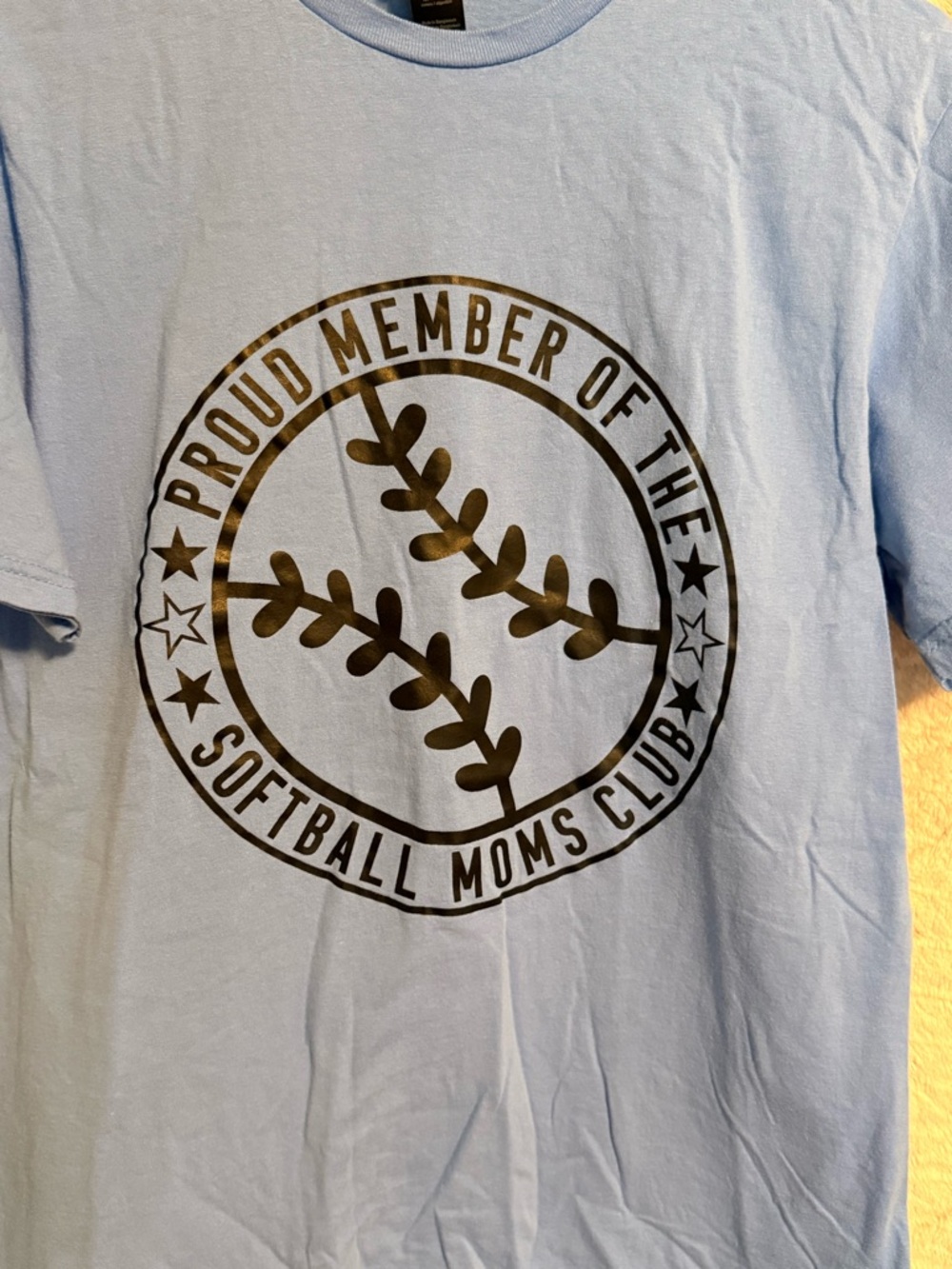 100% Cotton Light Blue Short Sleeve Tee with Black Softball Graphic